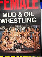 Close-up of central portion showing wrestlers photo and headline text