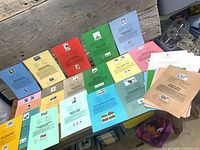 Spread of multicolour souvenir pages displayed on bench