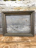 Full view of rectangular ornate frame front