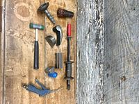overview of assorted auto body tools on bench