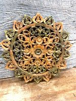 Front view of entire carved teak mandala