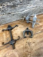 Overview of three tools: two pullers and small bench vise