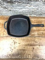 Top view square cast iron skillet showing ridged interior and both handles