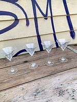 All four Mikasa crystal martini glasses lined up showing distinct patterns