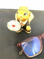 Front view of PenDelfin rabbit butler figurine with tray and envelope