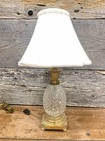 Full view of crystal pineapple lamp with shade and cord