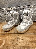 Pair of Salomon waterproof insulated boots, front three-quarter view