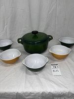 Full set showing Dutch oven with lid and five bowls