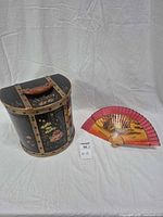 Hatbox and folding fan side by side
