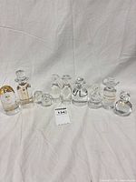 Full group of nine clear crystal figurines in size order