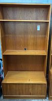 Full front view of one teak shelving unit