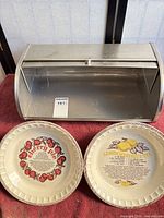 Bread box and two pie plates together