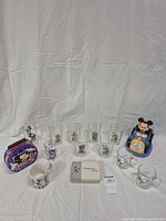 Entire lot showing all glasses, mugs, lunchbox, watch box, clock