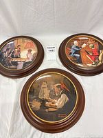 Three framed Rockwell plates grouped for overview