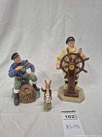 Front view of all three figurines showing overall appearance and size comparison