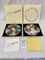 Both boxed plates with paperwork visible