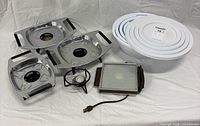 All components: electric warming plate, 3 chafing trays, fuel stand with canister, 5 nesting bowls with lids