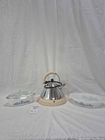 Group shot showing kettle, lidded casserole, divided dish