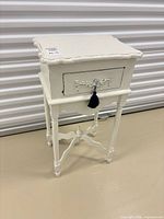Full view of side table showing overall form and color