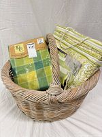 Basket holding two packaged linens