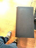 Top view of black engineered wood TV stand
