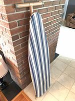 Ironing board front with striped cover