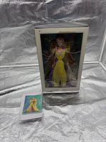 Boxed Barbie doll with COA envelope