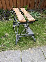 Full view of Black & Decker Workmate folded open on lawn