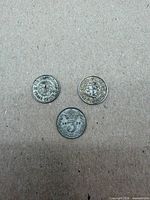 Front view of all three coins