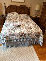 Full view of bed showing comforter, two shams, and bed skirt