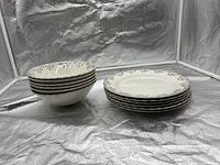 Stack of six bowls and six plates