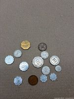 All 12 Maltese coins spread out showing shapes and sizes