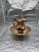 Full view of pitcher on basin