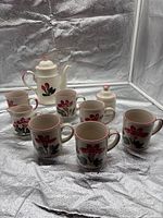 Full set showing teapot, sugar bowl, creamer and mugs