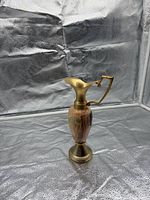 Full view of onyx ewer showing brass accents and Vero Onyx sticker