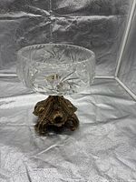 Front view of crystal compote on ornate metal base