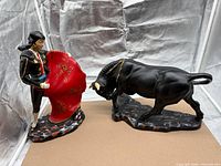 Full view of matador and bull figurines on bases