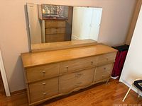 Front view showing dresser and attached mirror