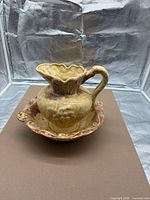 Pitcher nested in basin, front angle showing overall style and color