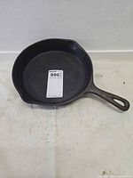 Top view of skillet showing interior seasoning, pour spouts and handle