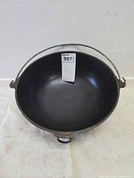 Top view of cast iron cauldron showing interior and handle