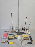Group shot showing all hand tools including mixing paddles, trowels, scrapers and sanding block