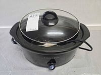 Front angled view of Crock-Pot with lid and power cord visible