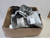 Box containing mixed galvanized steel duct fittings