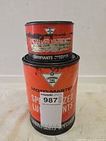 Front view showing both Moto-Master lubricant cans and Canadian Tire logo