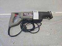 Left side view of Porter-Cable Tiger Saw with cord coiled