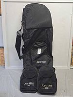 Front view of Selection golf travel bag showing attached Top-Flite pouches and shoulder strap