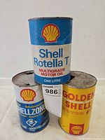 Front view of three Shell branded 1 L cans showing labels