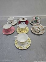 Group shot of 7 bone china teacup and saucer sets