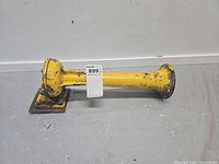 Side view of yellow cast metal air horn